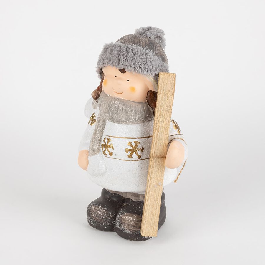 Figura decorativa de cerámica Niña con gorro y esquís 26cm