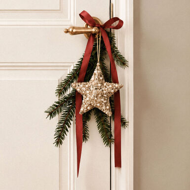Bola de Navidad estrella de lentejuelas dorada 12cm