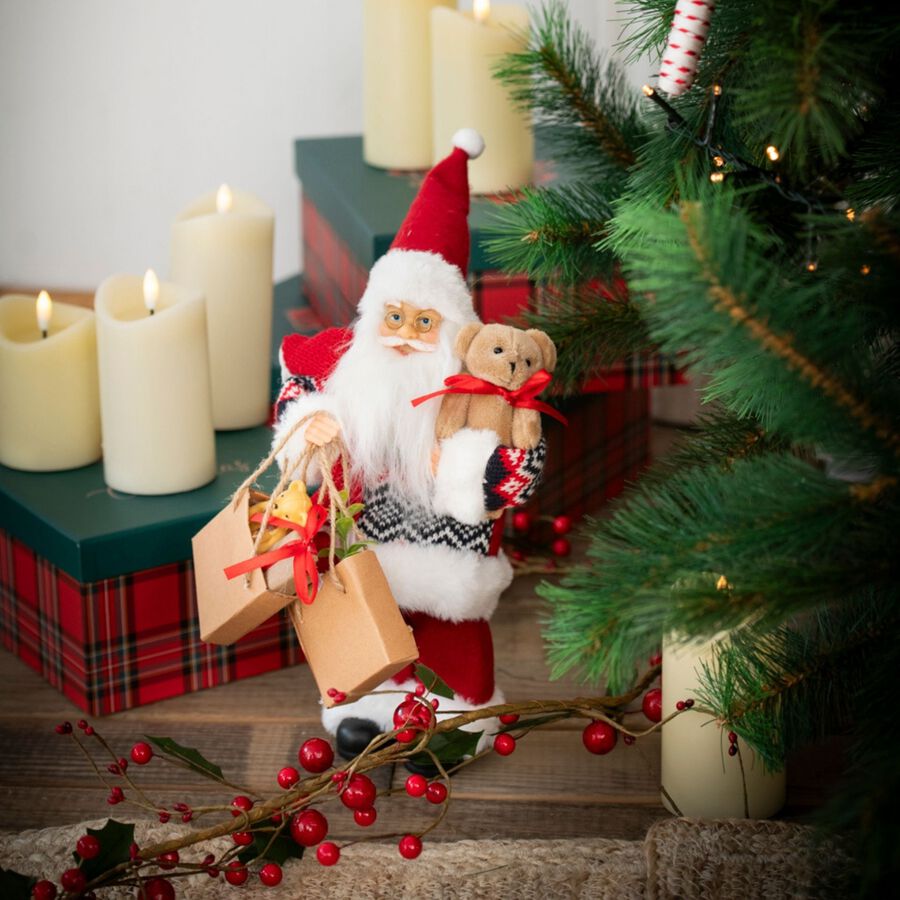 Figura decorativa Santa Claus con bolsa regalos y peluche 30cm