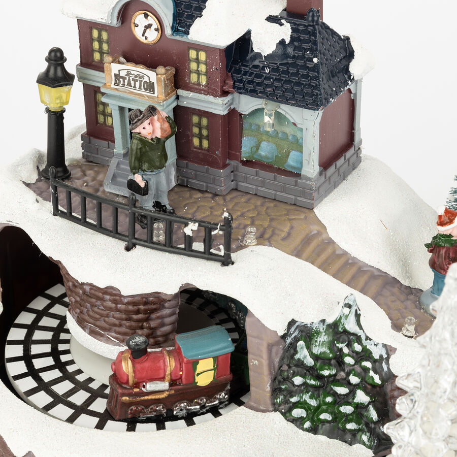 Figura decorativa con luz LED Pueblo Navidad musical 23,5x16x17cm