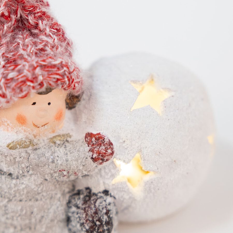 Portavelas ni&ntilde;a con gorro rojo de cer&aacute;mica