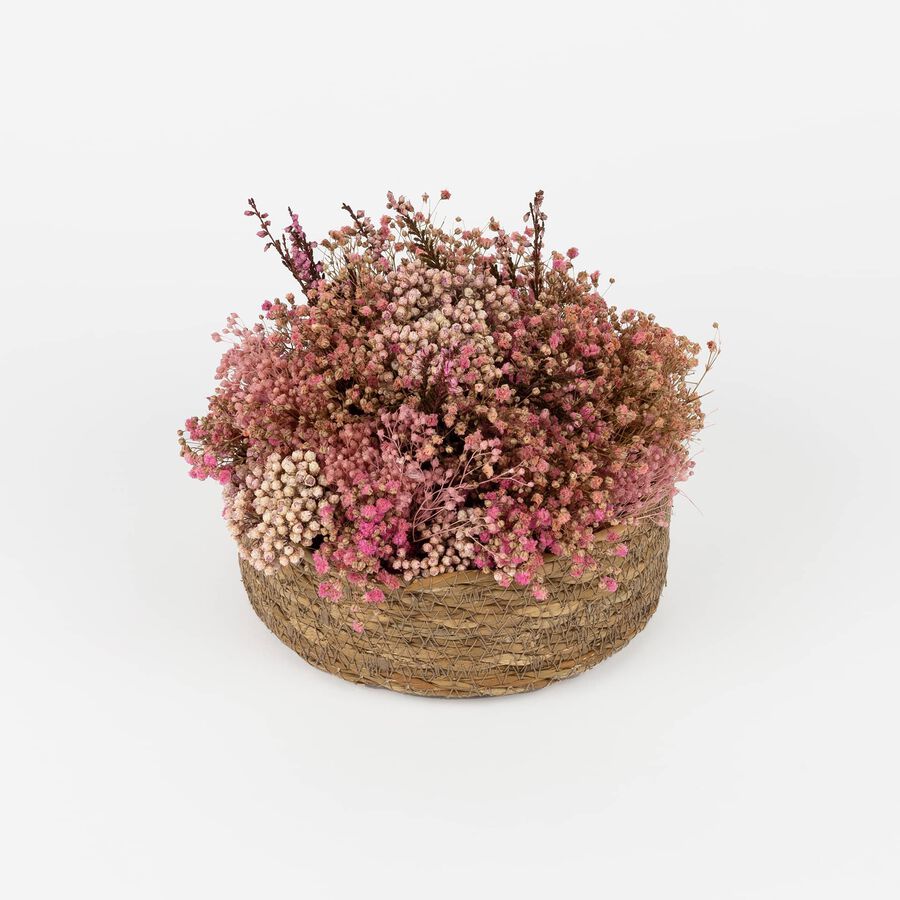 Centro floral con flores rosas variadas