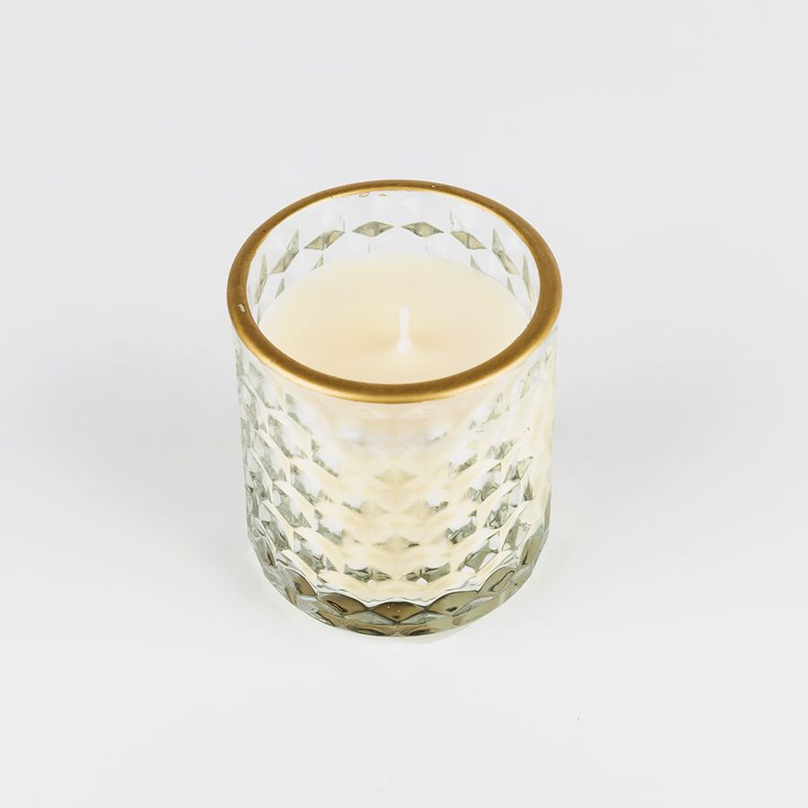 Vela perfumada con vaso de cristal dorado