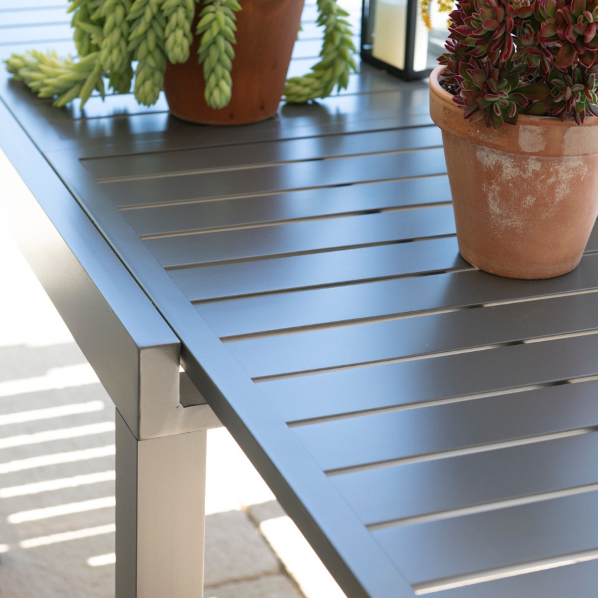 Mesa de jardín extensible de aluminio gris Nijar 90/180x90x76cm