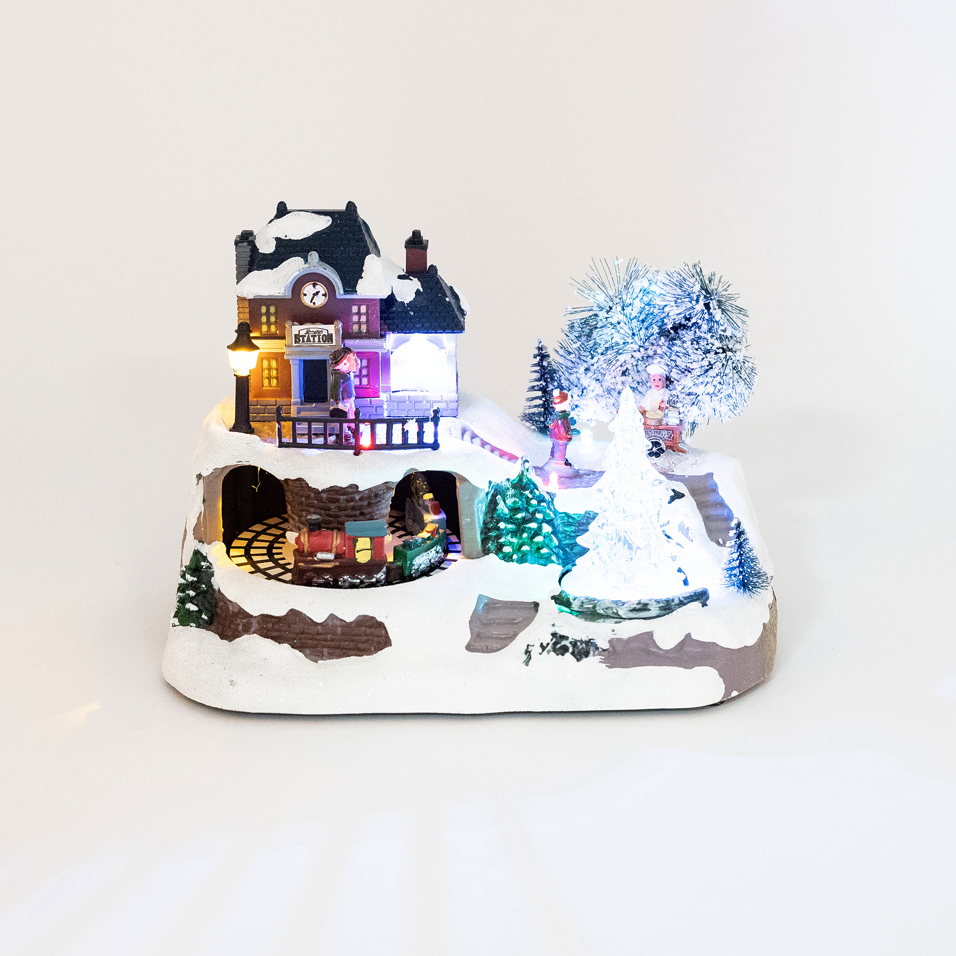 Figura decorativa con luz LED Pueblo Navidad musical 23,5x16x17cm