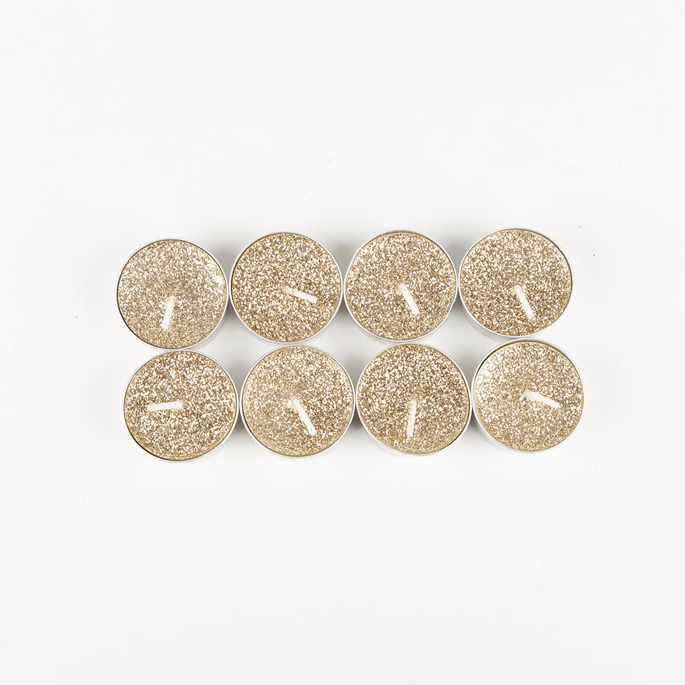 Set de 8 velas tealight doradas con purpurina