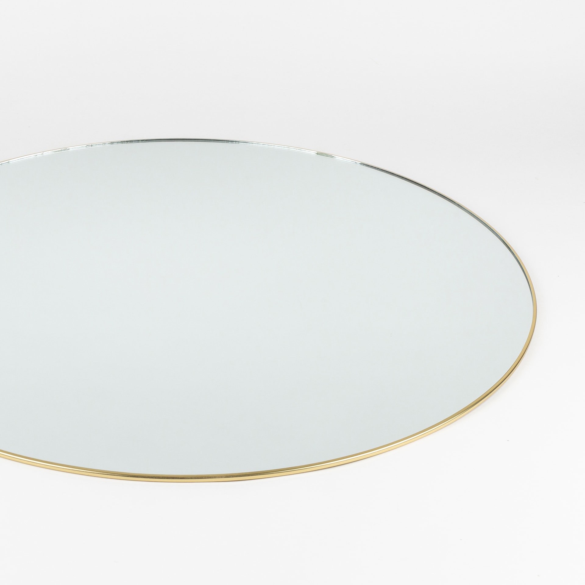 Espejo de pared redondo de metal dorado Orión Ø55cm