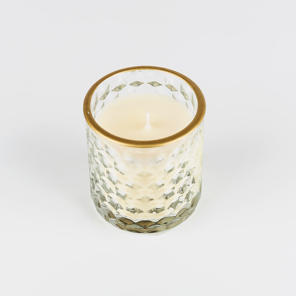 Vela perfumada con vaso de cristal dorado